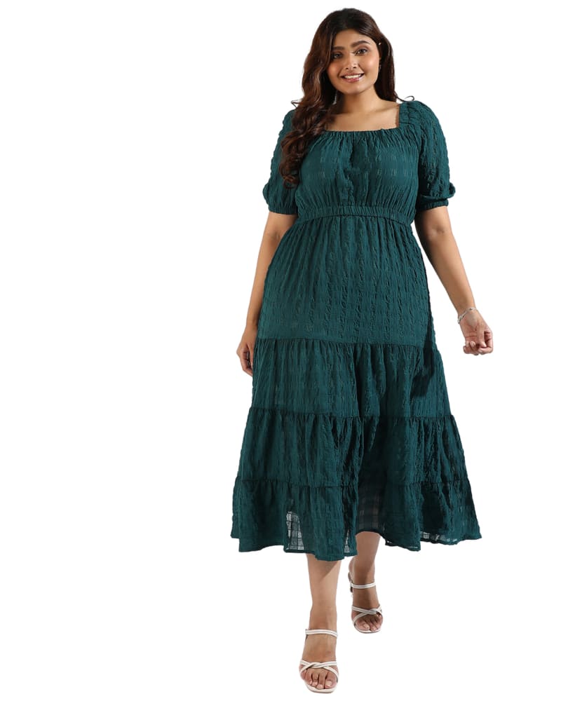 Front of a model wearing a size 6XL Women Teal Tiered Style Dresses in Forest Green by Instafab Plus. | dia_product_style_image_id:293697